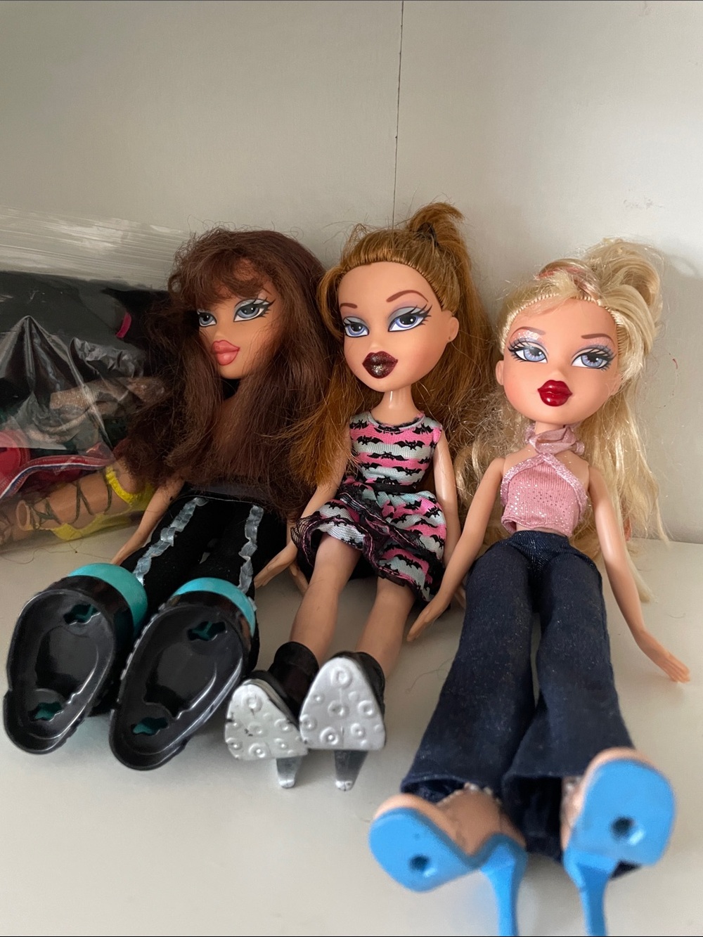 Three vintage Bratz dolls plus accessories